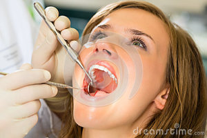 female-patient-dentist-dental-treatment-wearing-gloves-29801426
